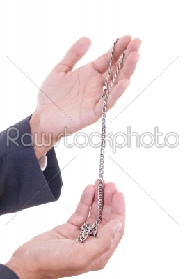 man hands holding silver necklace