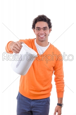 man holding electrical kettle to pour boiling water