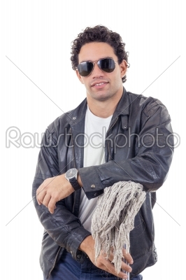 man in a leather jacket leaning on a broom