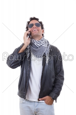 man in a leather jacket talking over phone