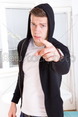 man pointing a finger at the camera