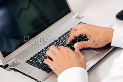 Man typing computer keyboard