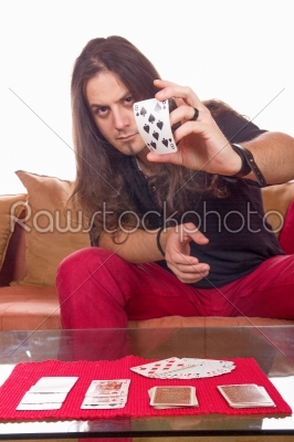 man with a deck of cards on the table