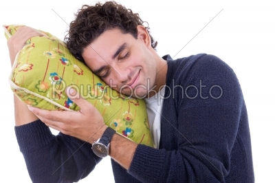 man with a pillow dreaming while and resting peacefully 