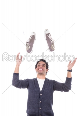 man with sneakers smiling about sales discount