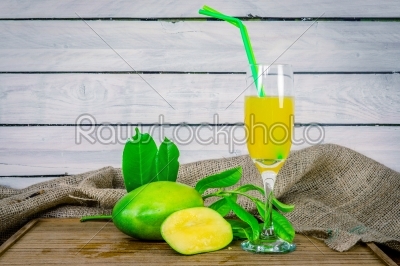Mango juice on a wooden table