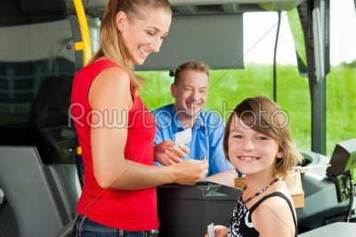 Mother and child boarding a bus