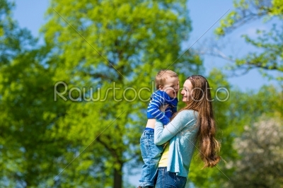 Mother and son on a summer meadow
