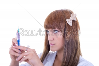 nurse holding a needle and syringe