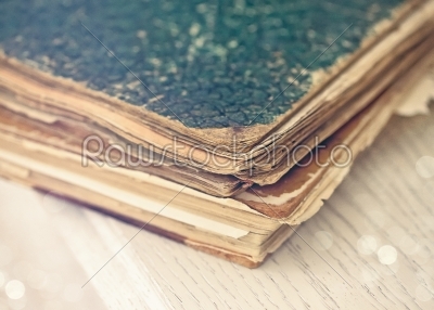 Old books of the Old binder on a white wooden surface