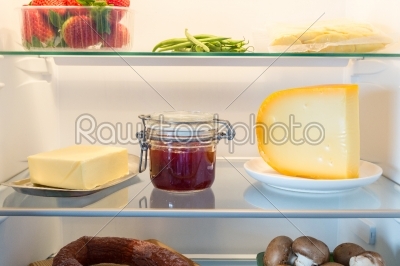 Open fridge filled with food