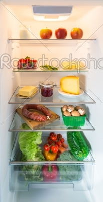 Open fridge filled with food