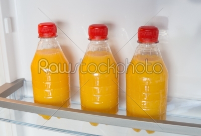 Open fridge filled with orange juice