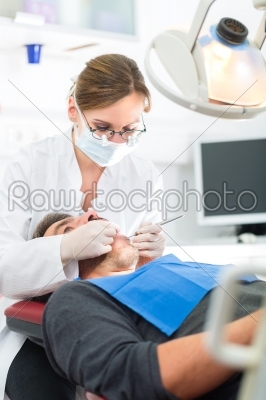 Patient with female Dentist - dental treatment
