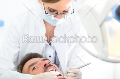 Patient with female Dentist - dental treatment
