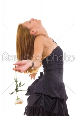 pensive girl in dress with a rose dreaming awake