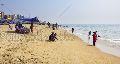 People enjoyeing beach life of Puri beach in eastern India a hol