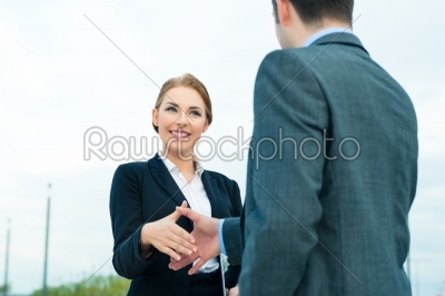 People welcoming with business handshake