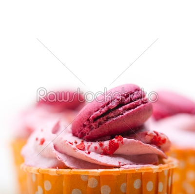 pink berry cream cupcake with macaroon on top