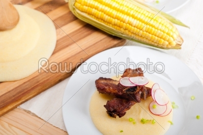 pork ribbs on polenta corn cream bed