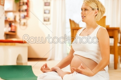 Pregnant woman doing pregnancy yoga