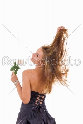 pretty girl with turn back holding a rose