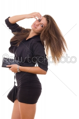 pretty woman with purse and wallet standing in black dress