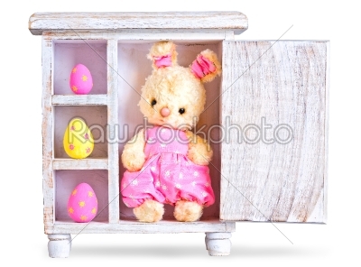 Rabbit bunny toy and easter eggs ona wood case isolated 