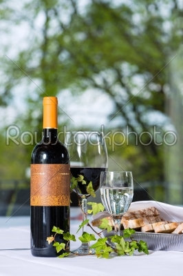Red wine with bottle and glass on a table
