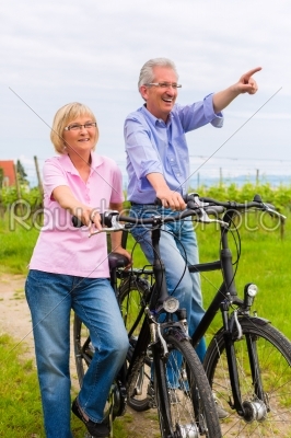 Seniors exercising with bicycle