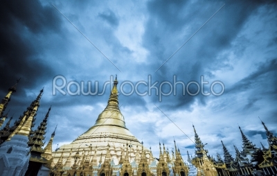 Shwedagon Pagoda Temple shining in the beautiful sunset in Yangon, Myanmar (Burma)