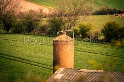 Silo storage with a field in the background