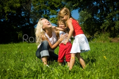smiling famili on meadows