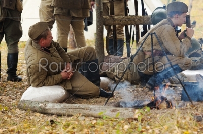 Soldiers resting near the fire