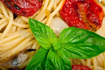 spaghetti pasta with baked cherry tomatoes and basil 