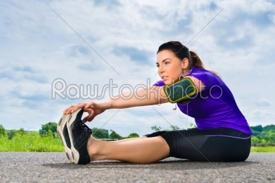 Sports outdoor - young woman doing fitness in park