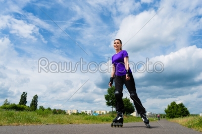 Sports outdoor - young woman skating in park