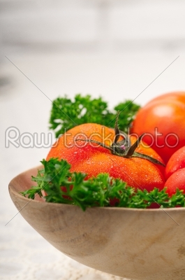 tomatoes on a wood bowl
