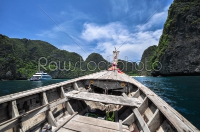 Traditional wooden boats in a picture perfect tropical Maya bay