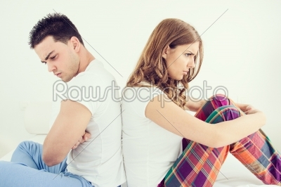 Upset young couple having marital problems