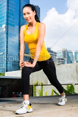 Urban woman sports - fitness in Asian city