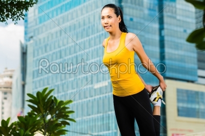 Urban woman sports - fitness in Asian city