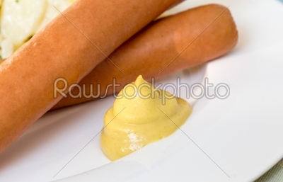 Vienna sausages with mustard close up