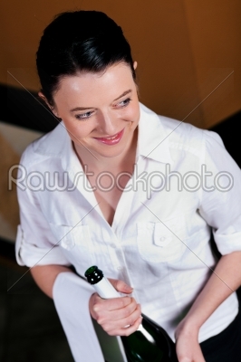 Waitress with Champagne in restaurant