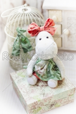 White hippo toy with textile and sewing accessory