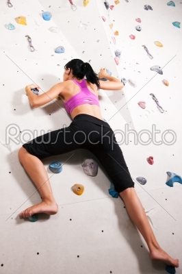 Woman at the climbing wall 