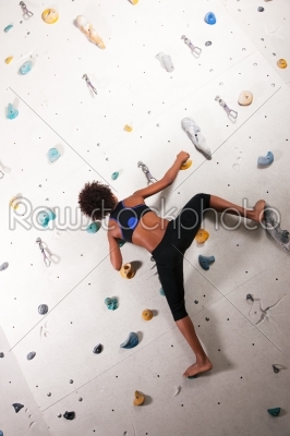 Woman at the climbing wall 