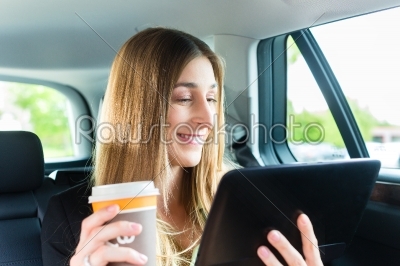 Woman traveling in taxi, she has an appointment