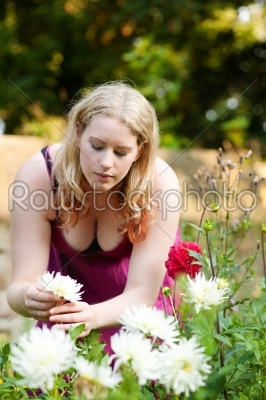 Woman working in the garden with flowers