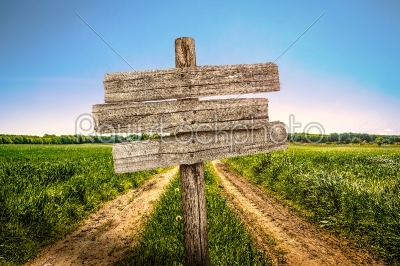 Wooden sign on a country road